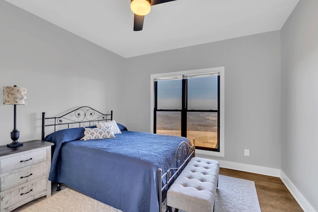 bedroom featuring ceiling fan and dark hardwood / wood-style flooring