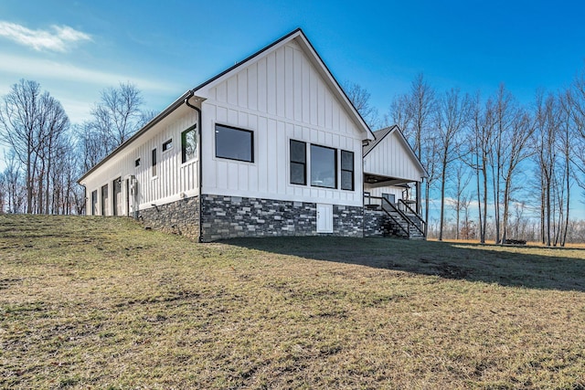 view of property exterior with a lawn