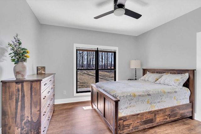 bedroom with dark wood-type flooring and ceiling fan