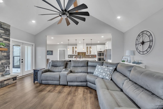 living room featuring french doors, ceiling fan, dark hardwood / wood-style floors, and high vaulted ceiling