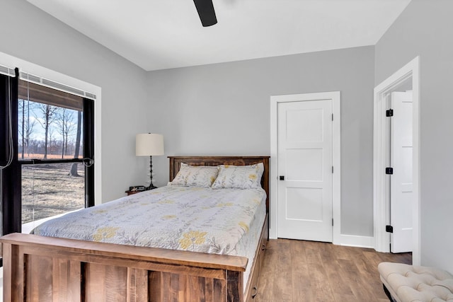 bedroom featuring light hardwood / wood-style flooring and ceiling fan