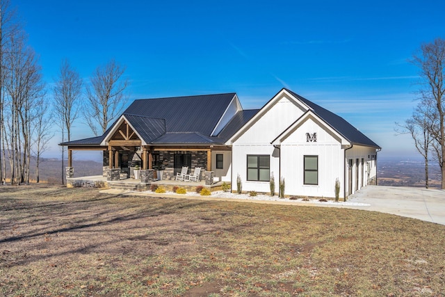 modern farmhouse with a front lawn