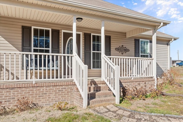 doorway to property featuring covered porch