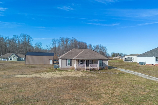 ranch-style house with a porch and a front lawn