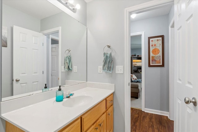 bathroom with vanity and hardwood / wood-style flooring