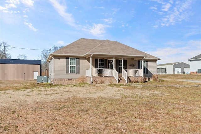 view of front of home featuring central AC unit, covered porch, and a front lawn