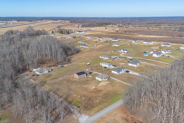 birds eye view of property with a rural view