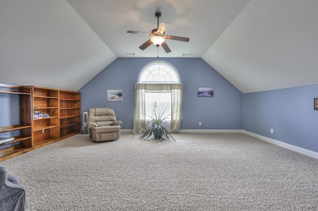 unfurnished room with carpet, lofted ceiling, and ceiling fan