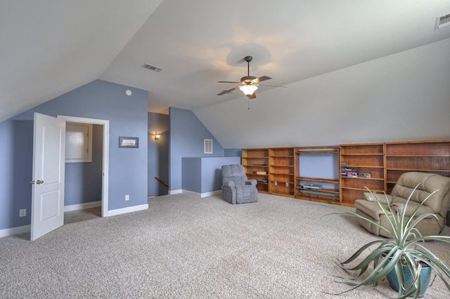 unfurnished room with vaulted ceiling, carpet floors, and ceiling fan