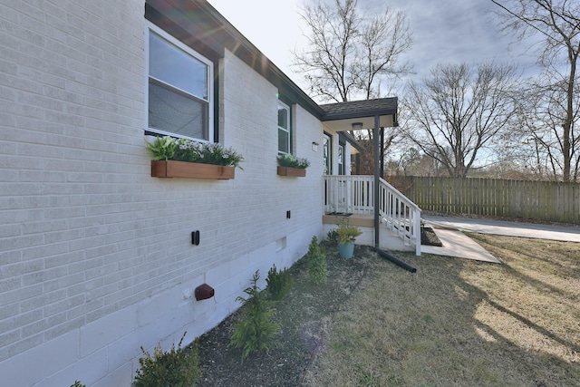 view of side of home featuring a yard