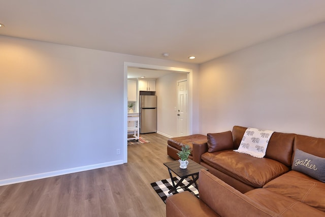 living room with light hardwood / wood-style flooring