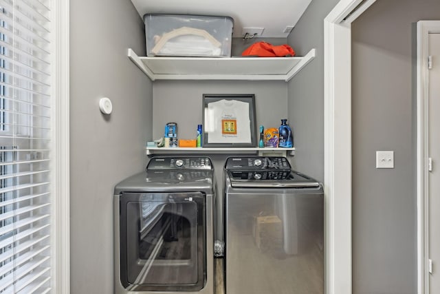 laundry room with independent washer and dryer