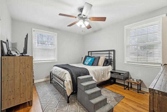 bedroom featuring wood-type flooring and ceiling fan