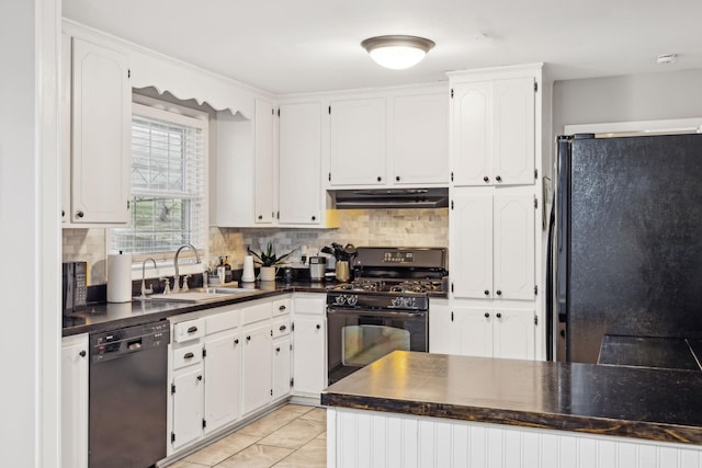 kitchen featuring tasteful backsplash, white cabinetry, sink, and black appliances