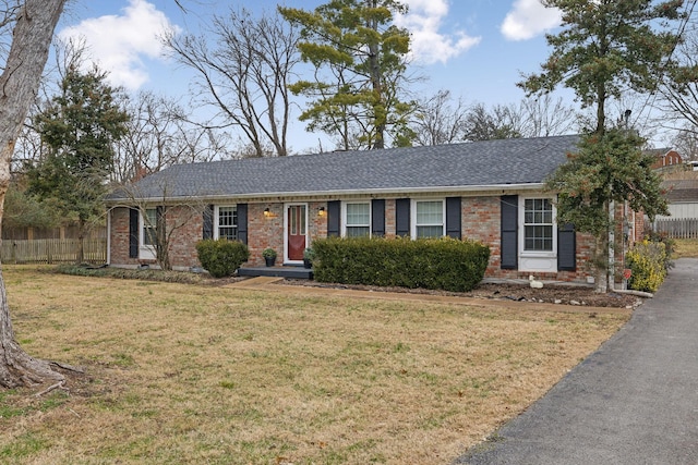 single story home featuring a front yard