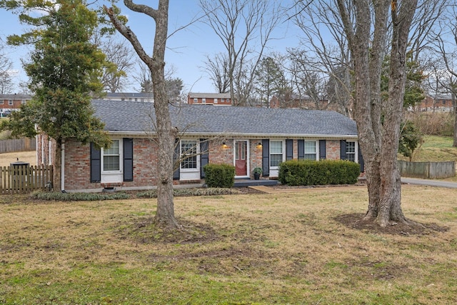 ranch-style house featuring a front yard