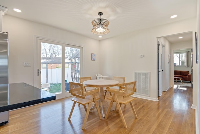 dining area featuring light wood-type flooring