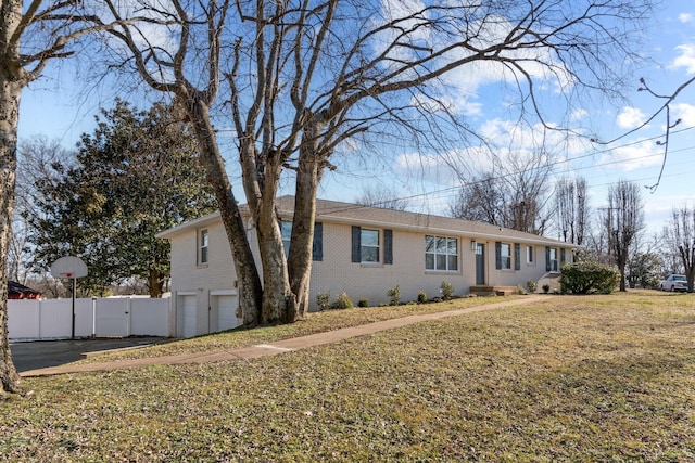 view of front of home with a garage and a front yard