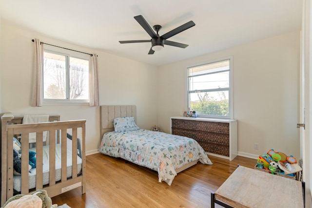 bedroom featuring ceiling fan and light wood-type flooring