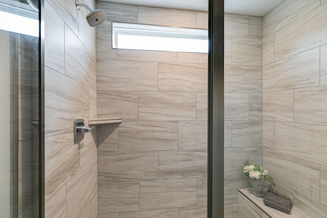 bathroom with tiled shower