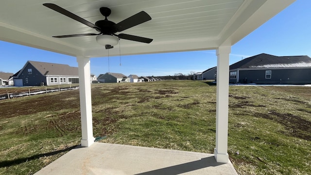 view of yard with ceiling fan