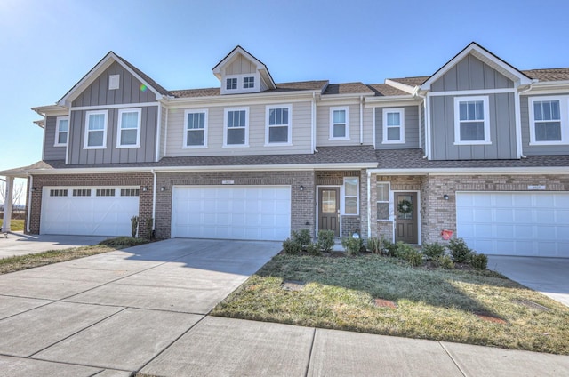 townhome / multi-family property featuring a garage