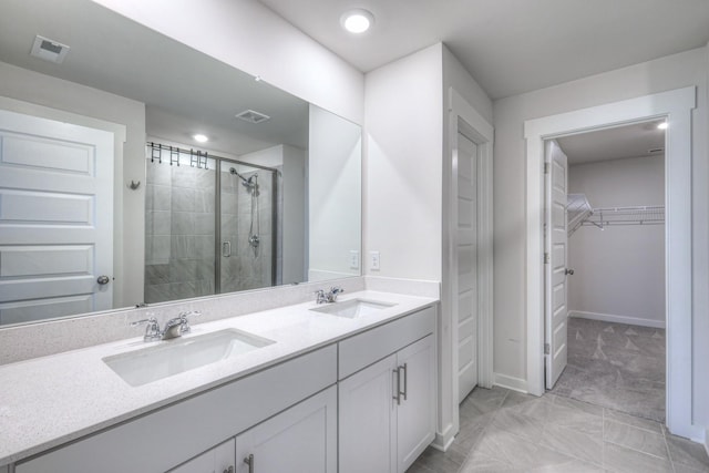 bathroom with walk in shower and vanity