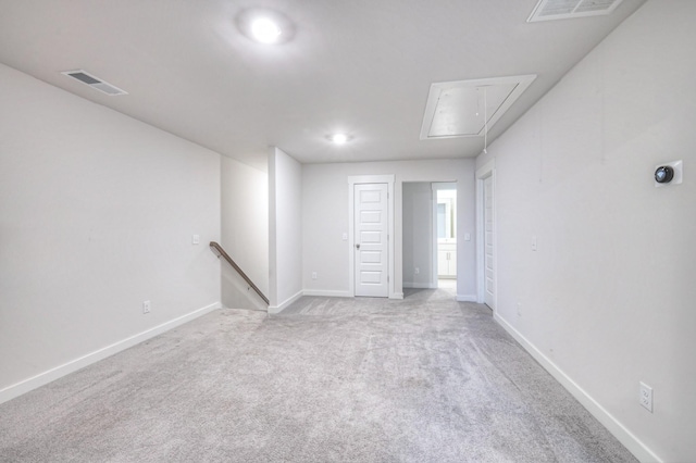 unfurnished room with light carpet