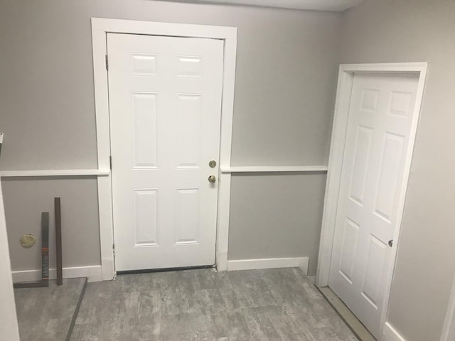 doorway with hardwood / wood-style flooring