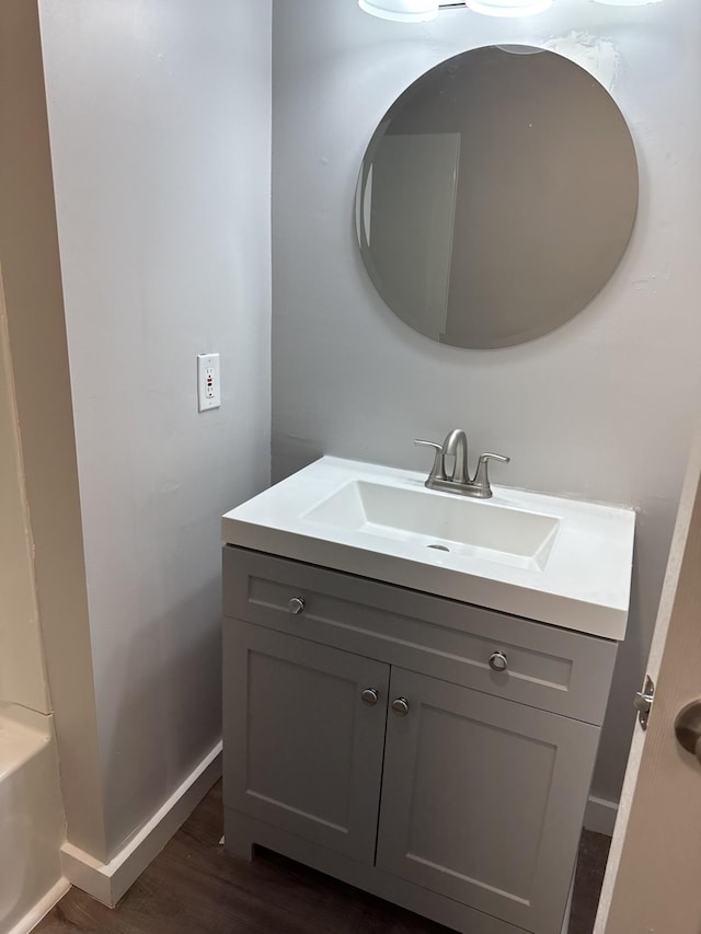 bathroom with hardwood / wood-style flooring and vanity