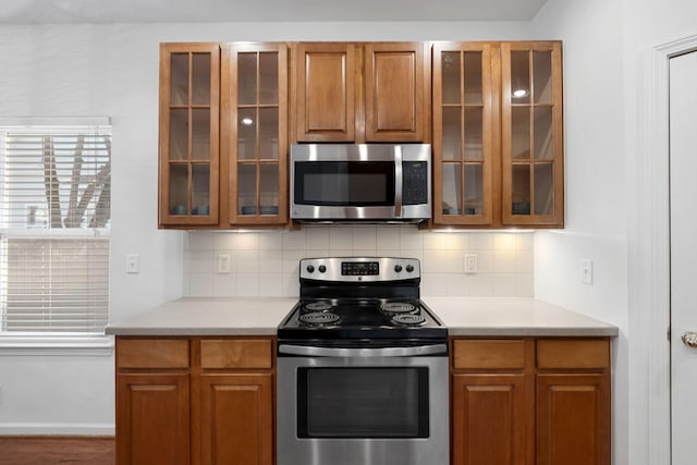 kitchen featuring appliances with stainless steel finishes and decorative backsplash