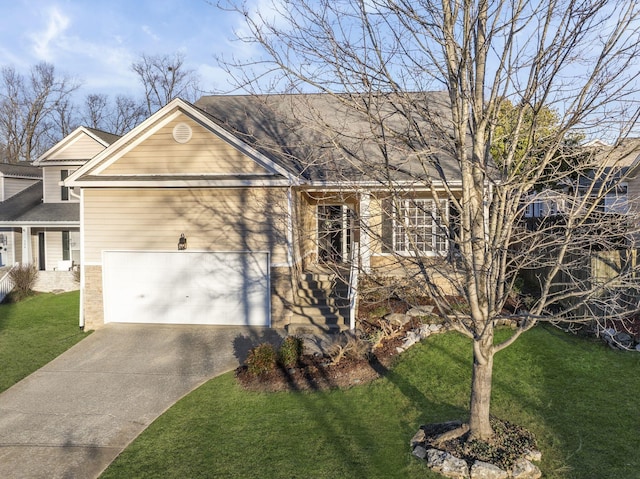 view of front of property with a garage and a front yard