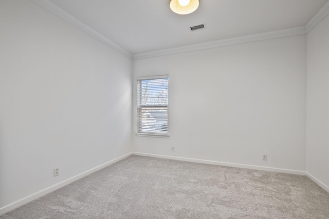 carpeted empty room with ornamental molding