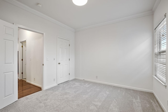 unfurnished bedroom with carpet floors and ornamental molding