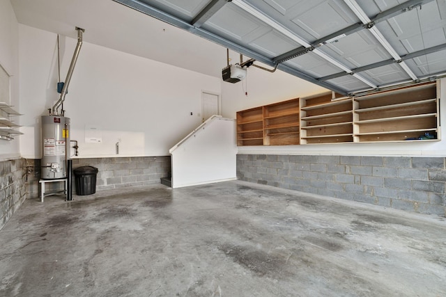 garage featuring a garage door opener and water heater