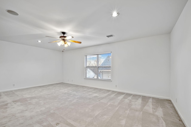 carpeted empty room with ceiling fan