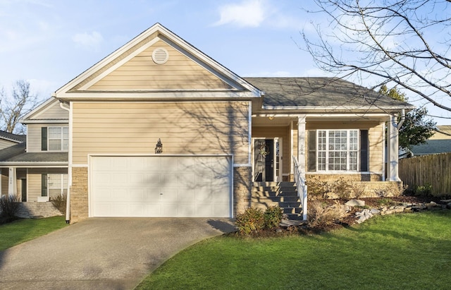 view of front of house with a garage and a front yard