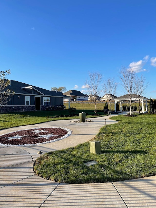 view of property's community with a yard