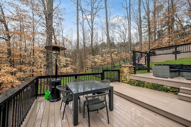 wooden terrace featuring an outdoor living space