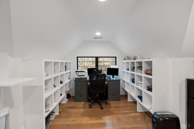 office with hardwood / wood-style flooring and vaulted ceiling