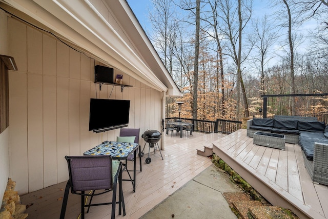 wooden terrace featuring outdoor lounge area