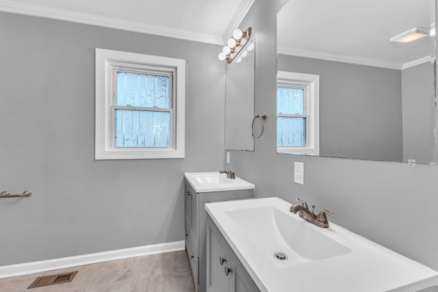 bathroom featuring crown molding and vanity