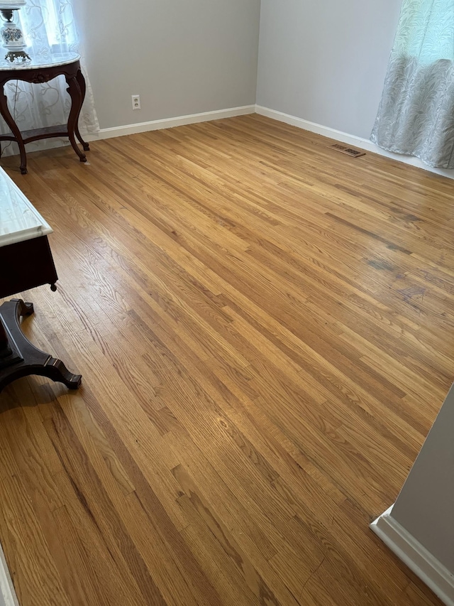 details with hardwood / wood-style flooring