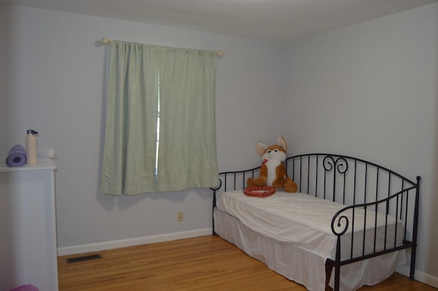 bedroom featuring wood-type flooring