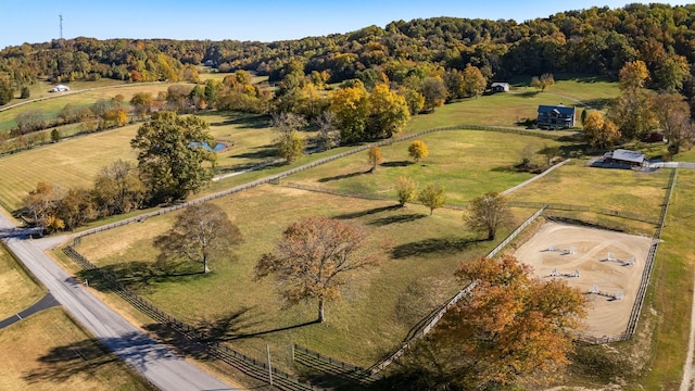 birds eye view of property with a rural view