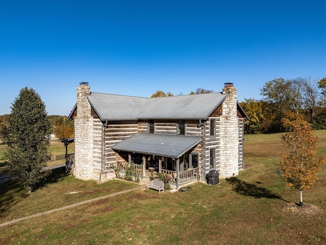 back of property with a yard