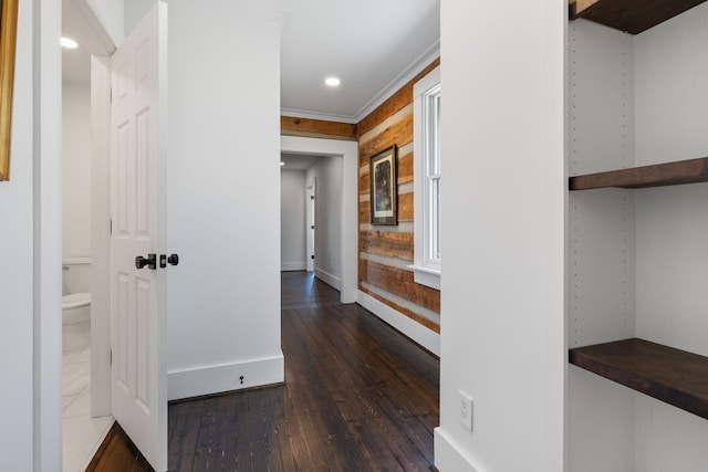 corridor with dark hardwood / wood-style flooring