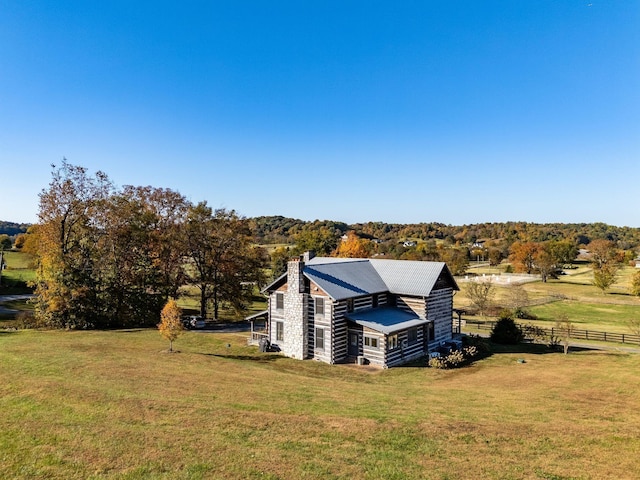 birds eye view of property featuring a rural view