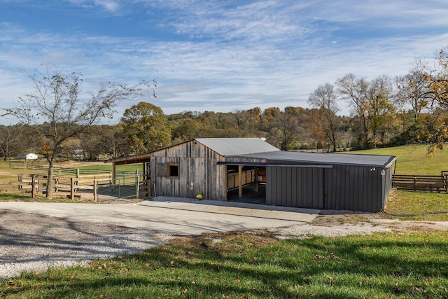 view of outbuilding with a rural view