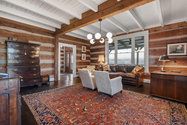 living room featuring beamed ceiling, dark hardwood / wood-style flooring, a chandelier, and wood walls